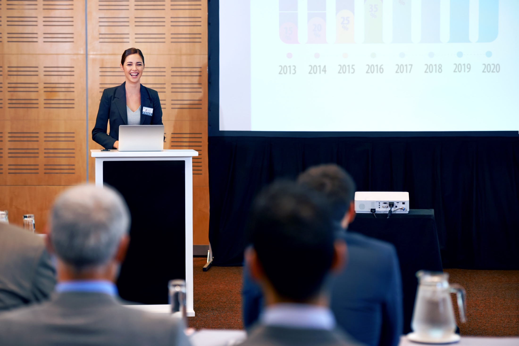 Conference presenter speaking to an audience